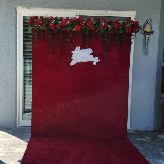 Red velvet backdrop with roses